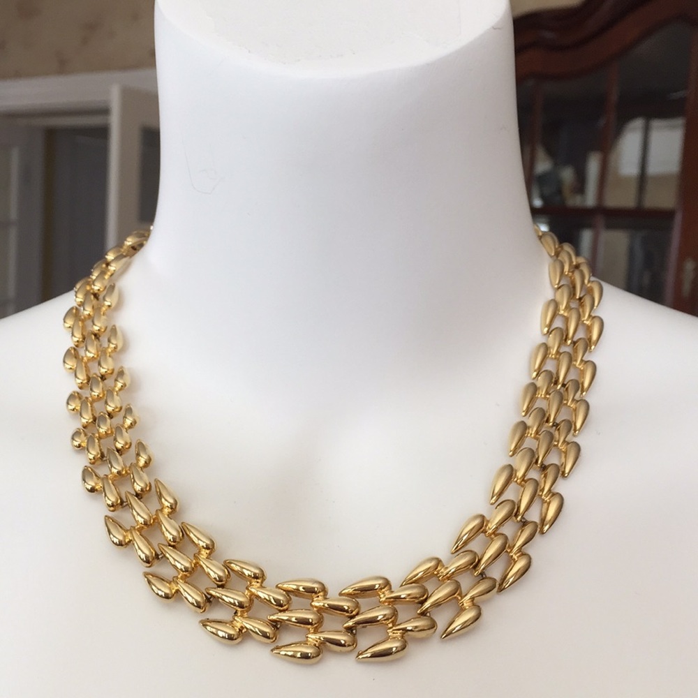 Gold tone woven necklace
